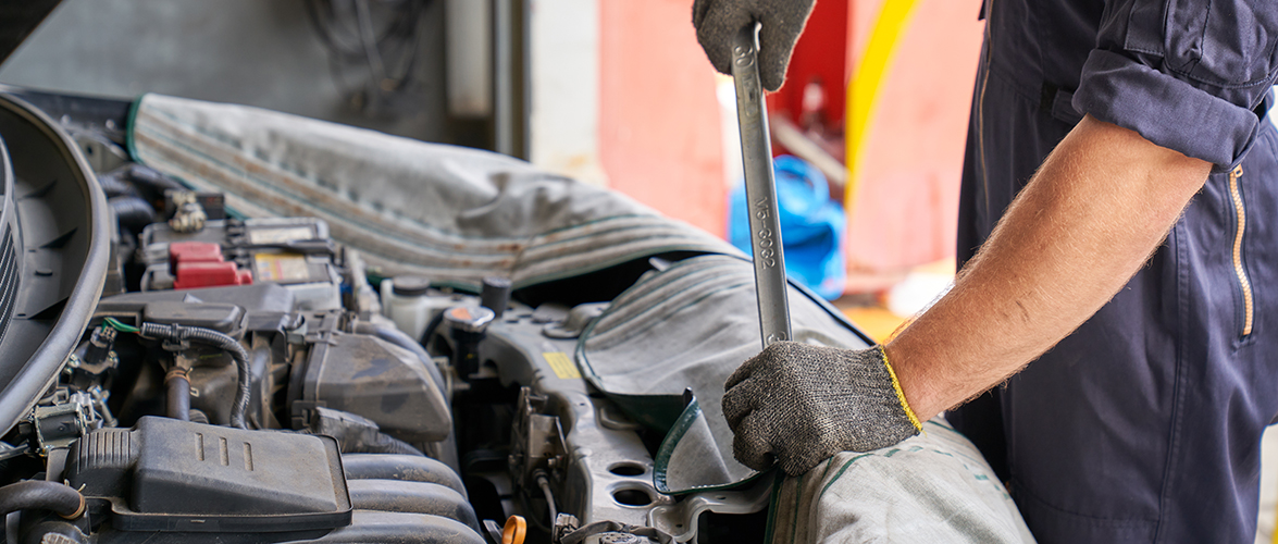 Mechanic man try to repair engine